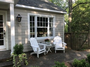 Adirondack chairs welcome you at the front door