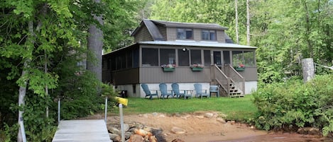 Large wrap around porch, partial view of dock