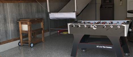 Garage rec room with 2 player Pop-A-Shot, darts, foosball, beverage cooler