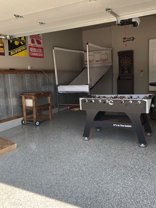 Garage rec room with 2 player Pop-A-Shot, darts, foosball, beverage cooler