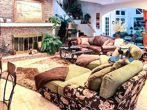 living room with fireplace and tv