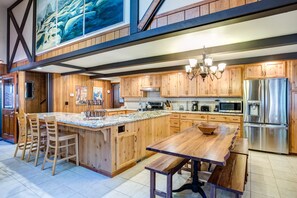 Kitchen with dining area table that seats 12