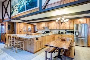 Kitchen with dining area table that seats 12