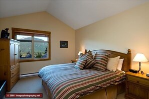 Master bedroom with king bed, ensuite bath, TV, DVD, and walk in closet.