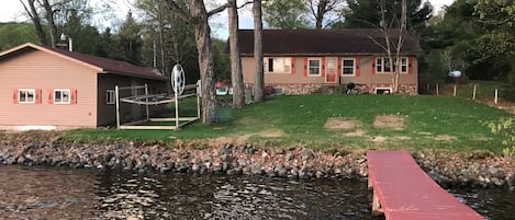 Main lake home with dry boat house on the left