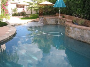 Lovely salt water pool with pebble tec and tanning bed.