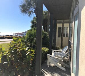 Front porch in front of Villa 3 across from Public Park. YOU CAN SEE THE BEACH!