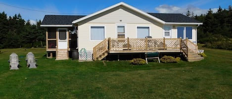 Full frontal, Chepstow Beach Cottage. BBQ on deck. Parking at side.