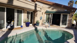 Pool area with doors  to Master bedroom, 2nd bedroom, and living room.  