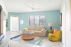 The flow of the open spaces in the condo is inviting & spacious leading to patio