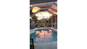 Enjoy this beautiful sunset right in your back yard. 5 rooms open to lovely pool