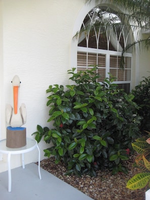 Hand carved pelican welcomes you to a home   with attention paid to every detail