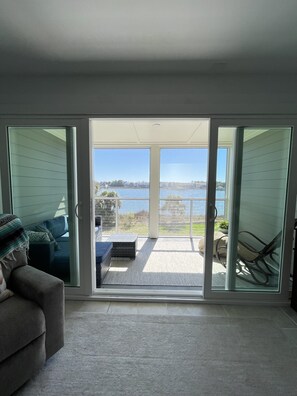 Living room with new sliding doors to screened in porch 
