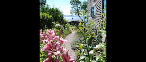 The garden path leads to your own private patio & entrance. Note the water view.