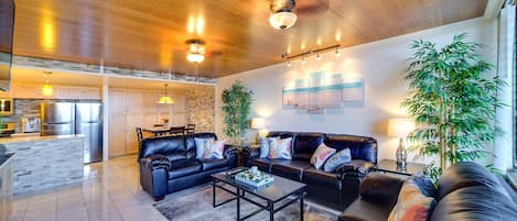 Living room with leather sofas, including queen sofa bed