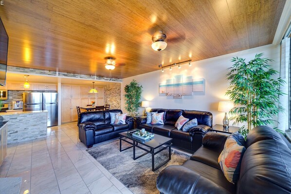 Living room with leather sofas, including queen sofa bed