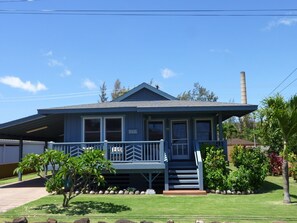 Beautiful yard with fenced rear and covered carport