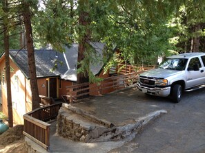 The driveway has parking for four vehicles.