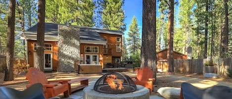 Fire pit w heated lounge chairs keep you warm year-round, in a fully fenced yard