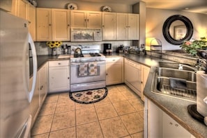 Immaculate Open Kitchen, Tile Floors, Granite Counter, Gas Stove & Microwave.