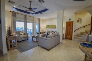 Unit F9 - 3rd-floor Living Room and Private Balcony, with stair up to 4th floor.