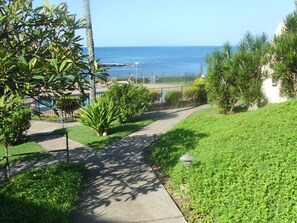 Walkway from the parking lot to our condo.  The pool is in the background.