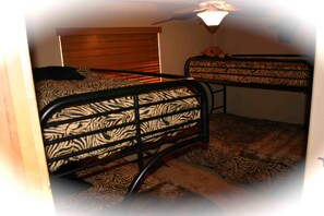 Bunk Room: 2 sets of single over twin bunk beds. 'Closet Tailors' custom closet.