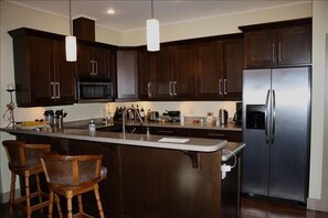 Fully equipped kitchen stocked with basic supplies...