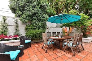 Large Private Patio with Teak Table and Chairs