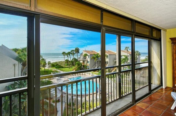 View of pool and beach from lanai