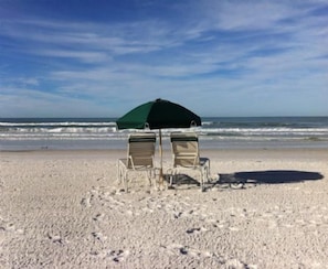 Complimentary Chairs & Umbrellas on our own Beach!