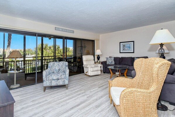 Large open living room with glass sliders to lanai