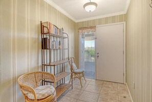 Spacious entry hall with seating to put shoes on