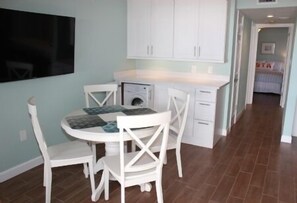 Dining Area w/ Washer & Dryer under Cabinets