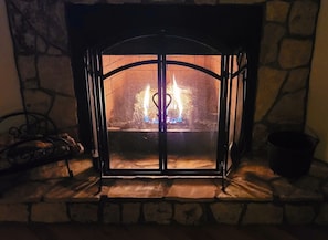 Gas fireplace w/ remote control on wall, just push the button, sit back & relax