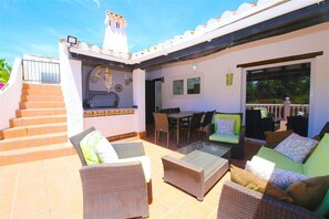 One of the terraces with outdoor dining area and relaxing seating