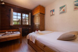 Bedroom with a double bed and a single bed