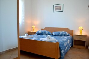 The bedroom with double bed and 2 bedside tables