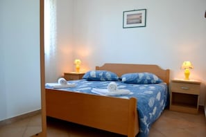 The bedroom with double bed and 2 bedside tables