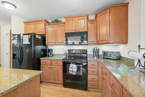 Kitchen--- Spacious with Plenty of Cabinet Space 