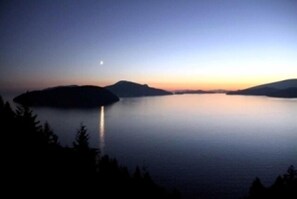 A moonrise at sunset in Lions Bay 