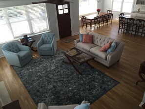 Enter into the spacious,  livning area and kitchen.  