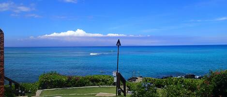 Beautiful view from lanai of condo looking left.  Tiki torches are lit at night