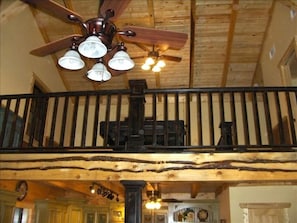 Balcony with Exposed Beams & Black Distressed Pool Table