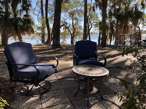 Two fire pits with incredibly comfortable swivel rockers overlooking the water.