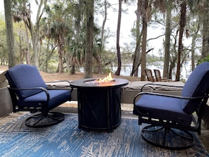 Two fire pits with incredibly comfortable swivel rockers overlooking the water.