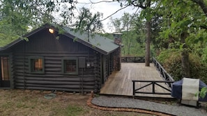 View from rear access drive/parking area. Walkway leading to side entrance.