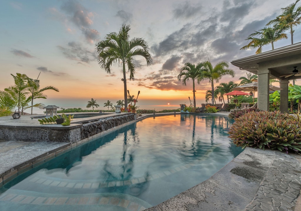 Swimming pool of a Hawaii Big Island beach house at sunset