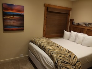 Down stairs bedroom with comfy queen size bed