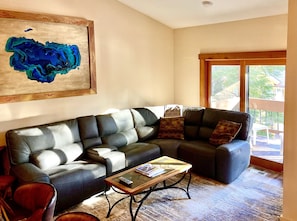 Large sectional and deck with a view of the village